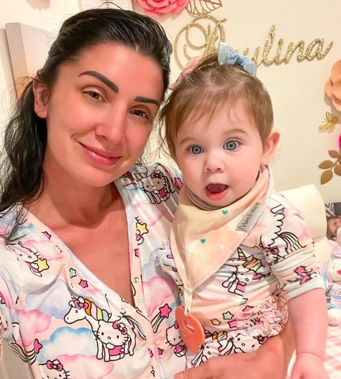 Brittany Nassif carrying her beautiful daughter Pauline Anne